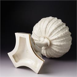 19th century Royal Worcester comport, painted with gilt on a cream ground, the stem formed as three entwined dolphins raising the shell shaped bowl, faint mark to base, H19.5cm