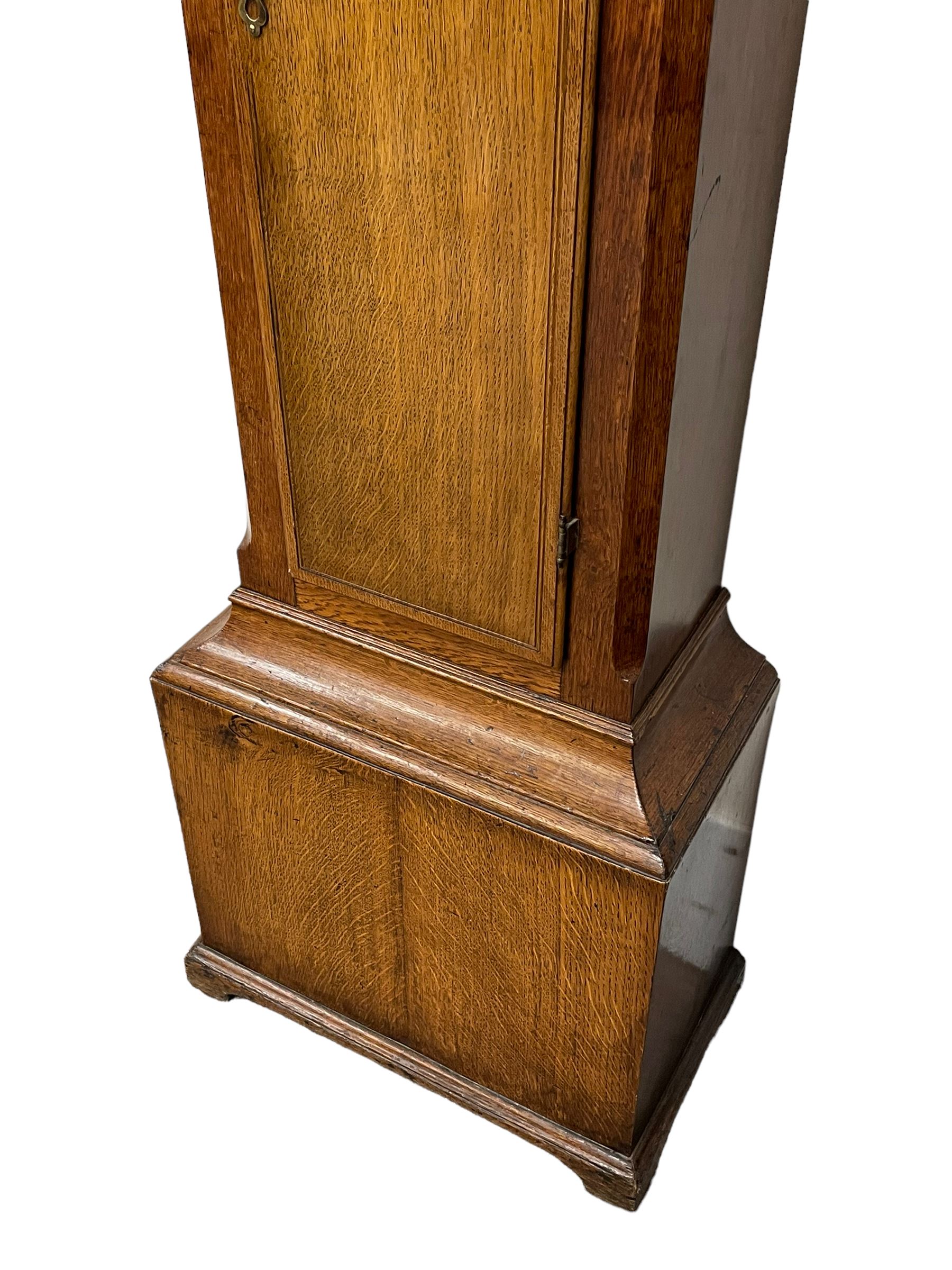 Henry Hindley of York – mid-18th century oak cased 8-day longcase clock,
flat topped caddy pediment with gesso finials, rectangular hood door flanked by wooden turned pilasters with capitals, canted trunk with a full-length break arch topped door on a short plinth with applied skirting and bracket feet, brass dial with a silvered chapter ring, Roman numerals and five-minute Arabic’s, minute and inner quarter hour tracks, matted dial centre with subsidiary seconds dial, blued steel hands and female head pattern spandrels, silvered calendar dial to the break arch with dolphin spandrels, four pillar rack striking movement, striking the hours on a bell. With weights and pendulum. 
H250 W48 D27
Henry Hindley originally from Wigan (Lancs) is recorded as working in York from Petergate 1731-41 then Stonegate 1741-1771. A famous and highly innovative maker, often referred to as the “Tompion of the North.” 
