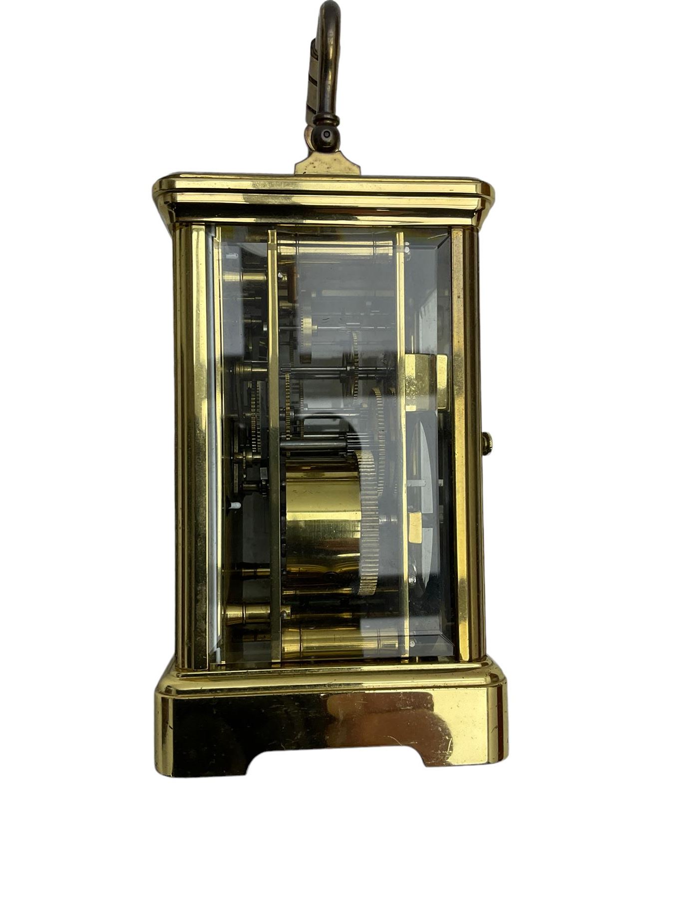 8-day French 20th century corniche carriage clock with a striking movement and repeat work, white enamel dial with Roman numerals, minute track and steel moon hands, dial inscribed St James, London. With a jewelled lever escapement, striking the hours and half hours on a coiled gong. 
