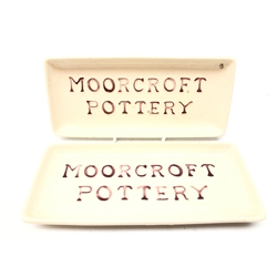  Two Moorcroft Pottery rectangular advertising trays, 20.5cm x 9cm   