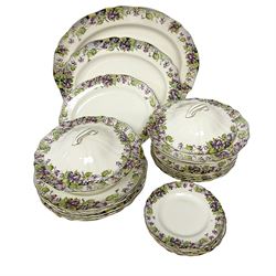 Royal Doulton Violets pattern part dinner service, comprising six dinner plates, six side plates, five dessert plates, two covered serving dishes and three serving platters of various sizes (22) 