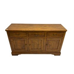 Willis & Gambier - oak sideboard, three drawers over three panelled cupboards, on bracket feet 