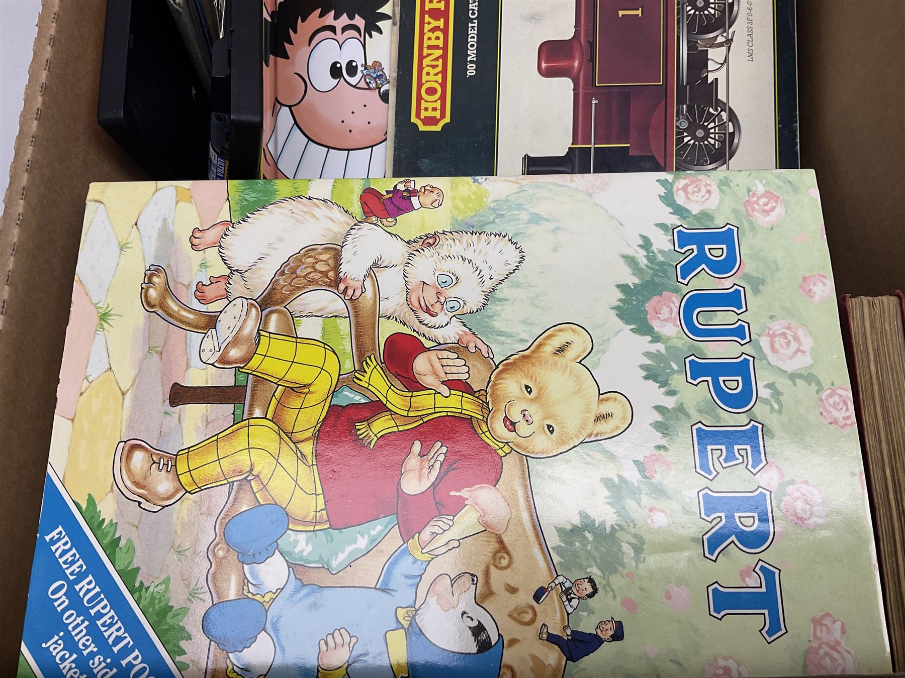 Collection of Rupert Bear annuals together with, two Corgi models, postcards and other ephemera 