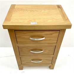 Light oak bedside chest, three drawers, style supports 