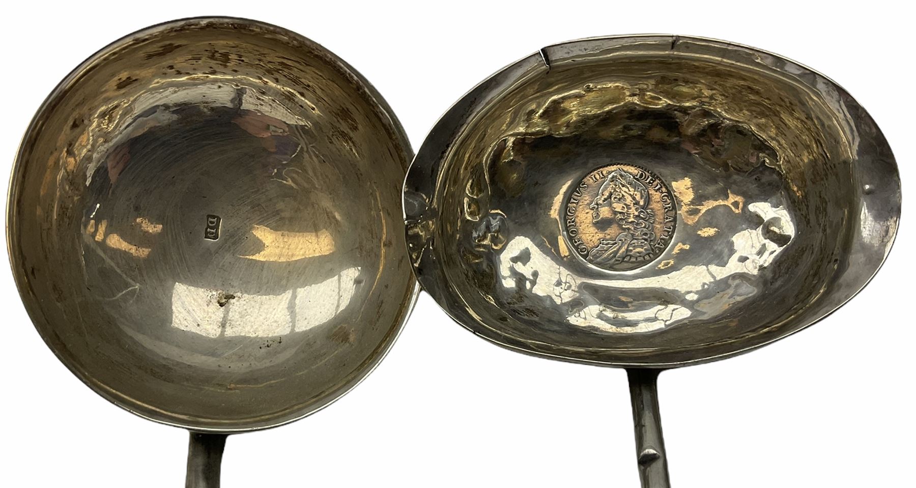 Two Georgian silver toddy ladles with baleen twist handles, (neither hallmarked), one with inset coin to bowl, together with a group of silver plate including cruet stand enclosing two glass bottles with stoppers, shaker and preserve pot with spoon, pair open salts with glass liners, etc. 