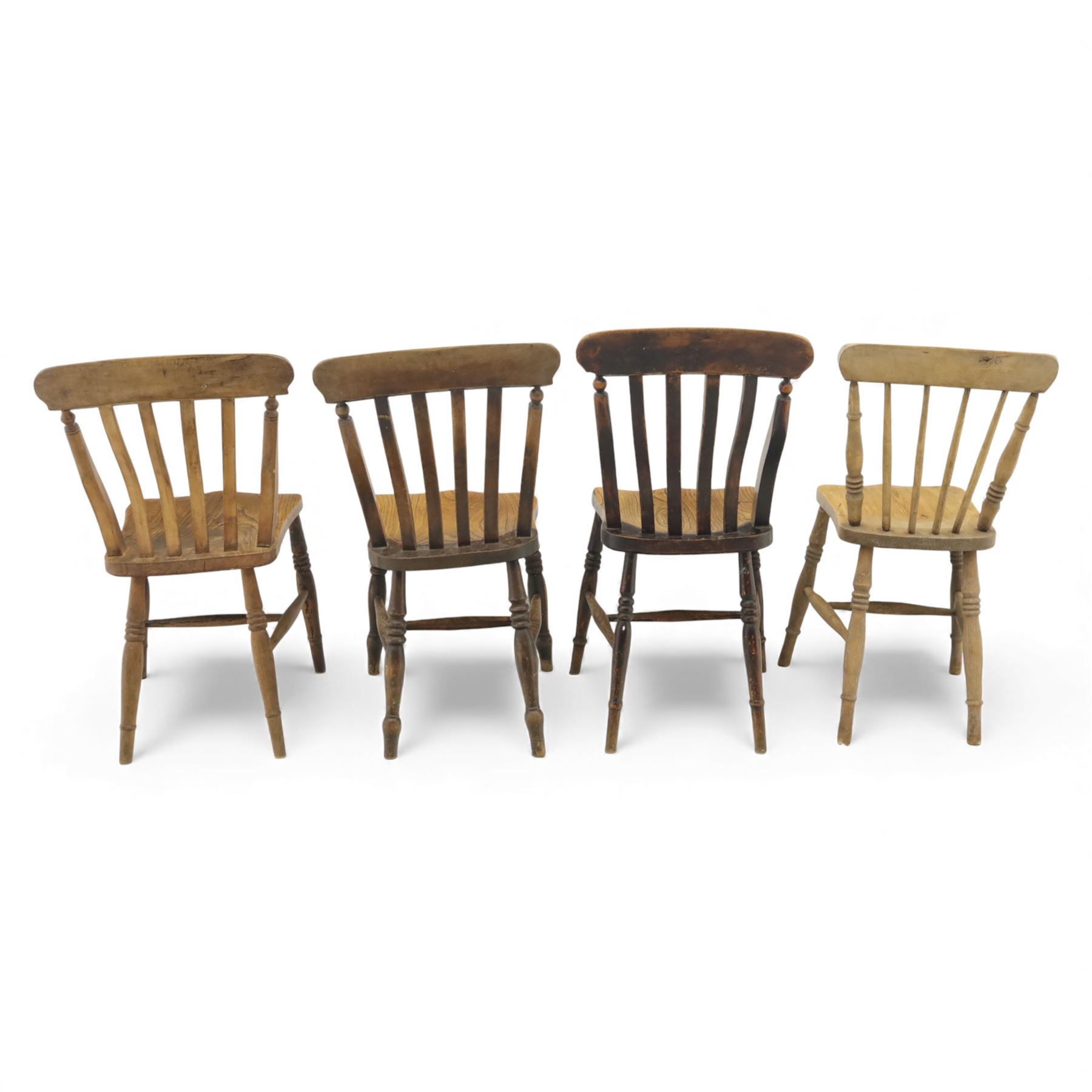 Eight Victorian farmhouse chairs in elm and beech, spindle-back frames with moulded seats, on turned and plain supports