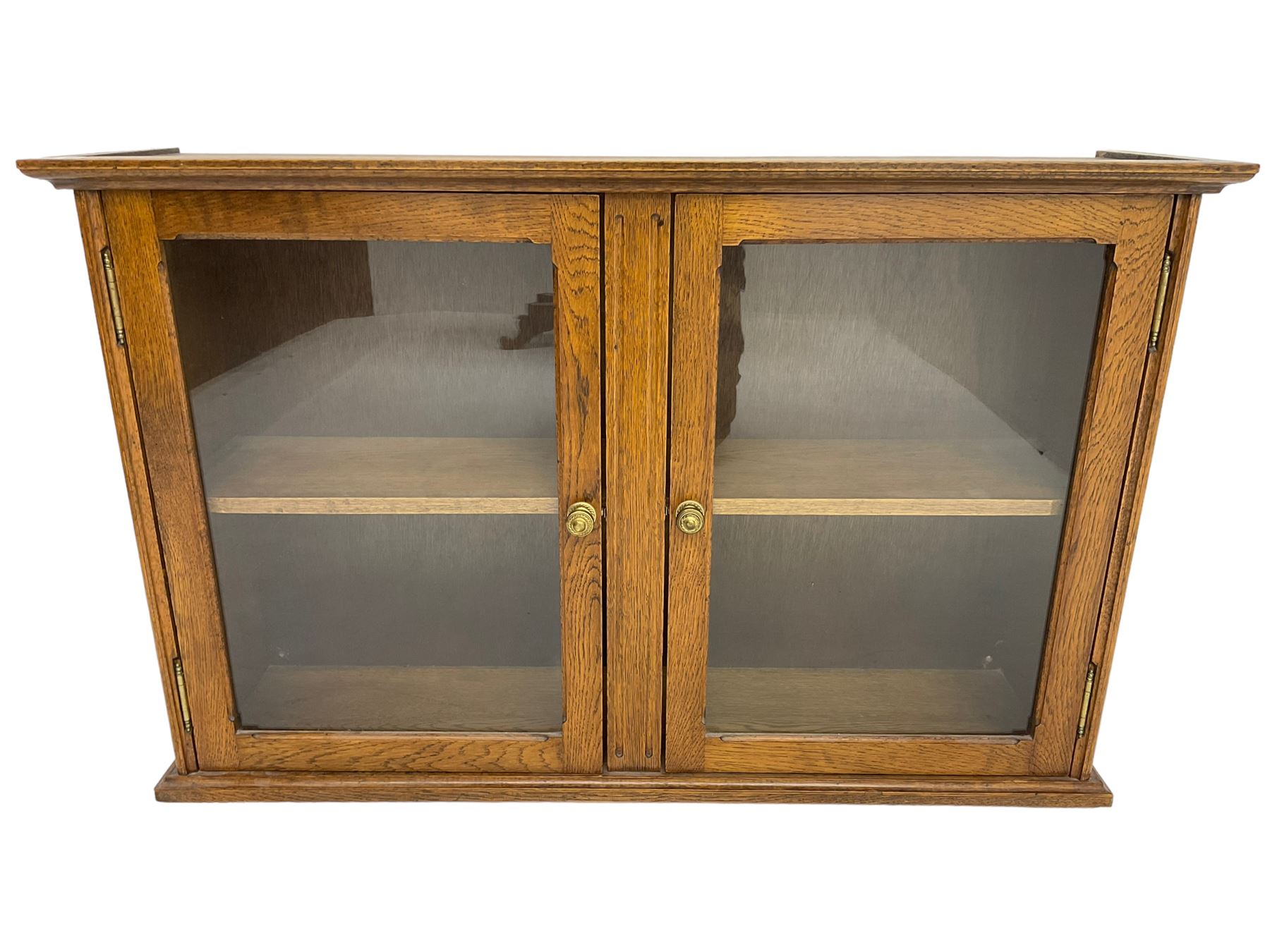 20th century low oak and glazed bookcase, double cupboard enclosing two shelves