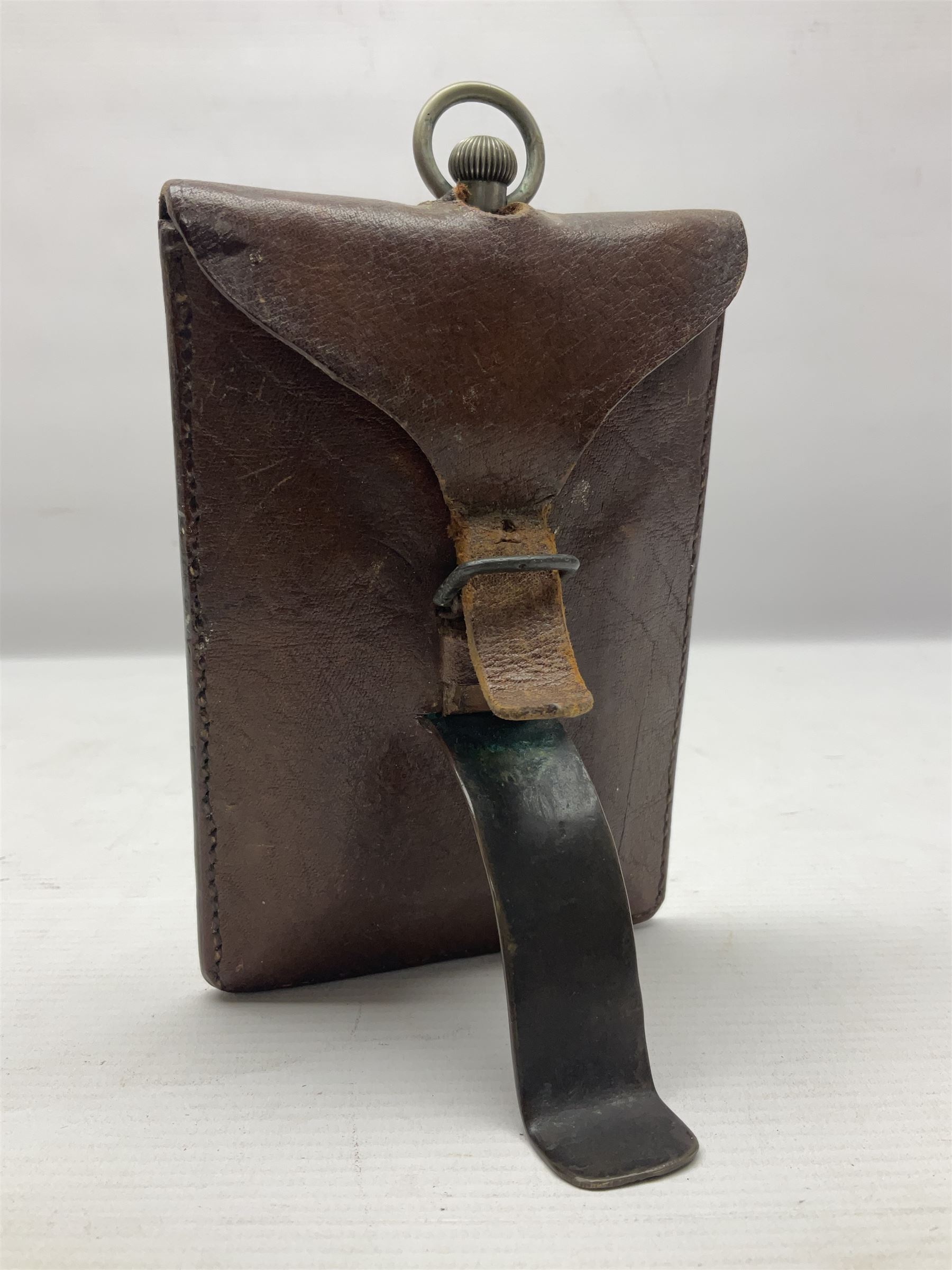 Early 20th century British Army officer's campaign clock in the form of a key-less wind nickel cased pocket watch with white dial, Roman numerals and subsidiary seconds dial, inscribed H. Williamson Ltd. London 9138F, the back with broad arrow and 9138F; in leather travelling case with dial aperture and brass easel support H14cm