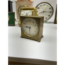 Miniature 'Zenith' travel alarm clock, in engine turned brass case with silvered numerical chapter ring, H5cm, together with other clocks to include Aynsley Portland Ware mantel clock, with moulded peacock design, Europa travelling clock, brass carriage clock, German copper clock of cube form etc