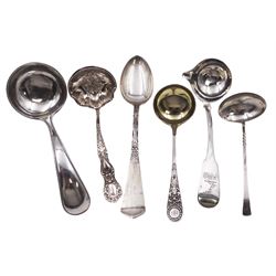 Group of silver flatware, to include early 19th century Irish silver Fiddle pattern sauce ladle, the circular rat tail bowl with lip, engraved with crest to terminal, hallmarked James Scott, Dublin 1822, L15cm, Victorian Scottish silver sauce ladle, with silver-gilt bowl, embossed foliate decoration and engraved initials, hallmarked Thomas Ross & Sons, Glasgow 1896, modern Scottish silver ladle, with oval bowl and twist detail to handle, hallmarked Isle of Mull Silver Co, Edinburgh 1994, Dutch silver sauce ladle, with beaded rim, marked with Lion Passant, Minerva Head, date letter for 1887 and makers mark, L15cm, American silver sauce ladle, with embossed foliate and scroll detail to bowl and handle, stamped Sterling, with maker's mark for Manchester Manufacturing Company, and a German silver hammered and engraved spoon, stamped Handgehammert 800, with crown and crescent mark, approximate total weight 6.75 ozt (210 grams)