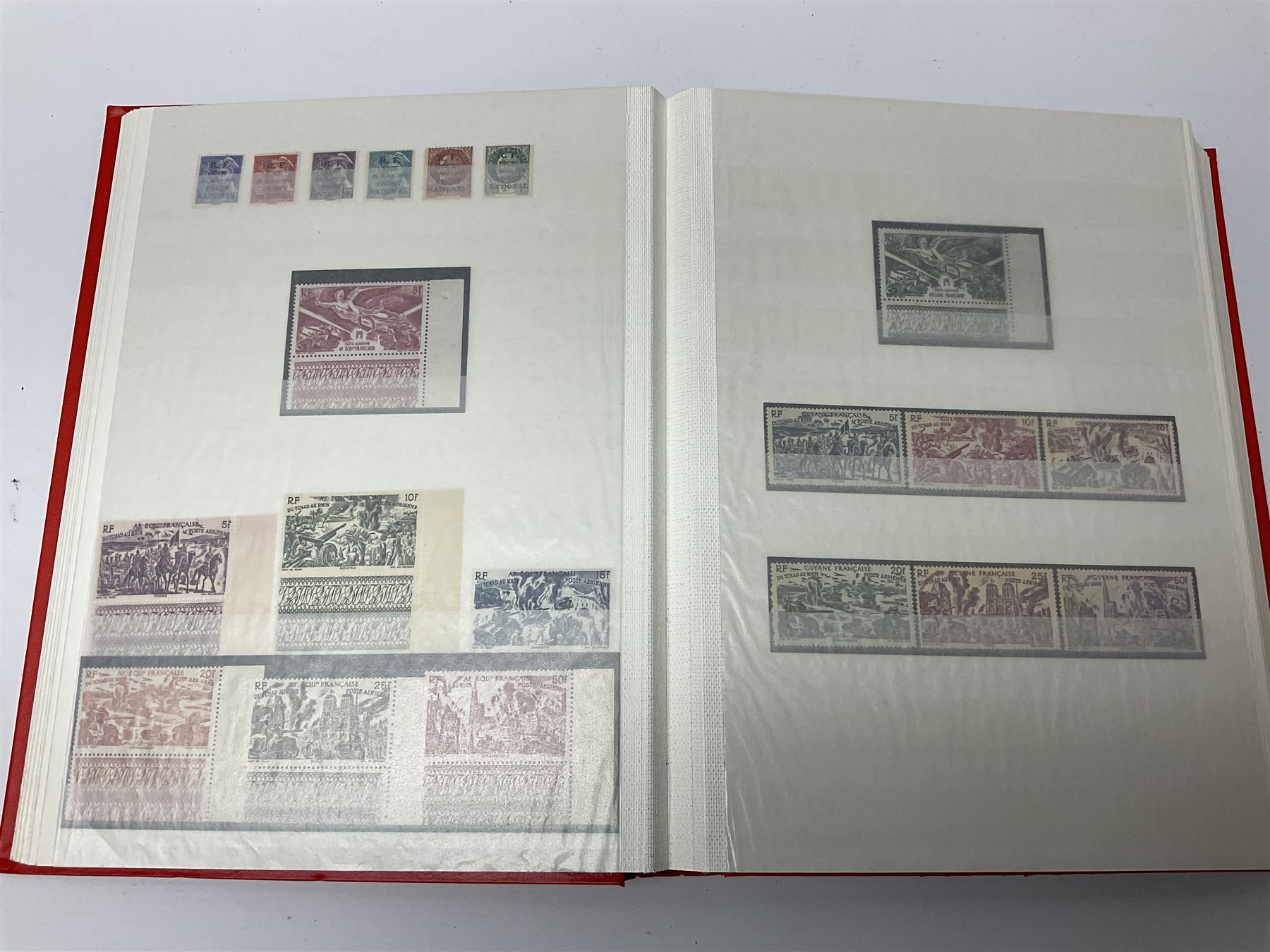 World stamps with many relating to Victory in Europe including King George VI '8th June 1946' stamps from various countries including Antigua, British Guiana, British Honduras, British Solomon Islands, Cayman Islands, Ceylon, Fiji, Grenada, Montserrat, St Helena etc, both mint and used stamps seen, housed in three stockbooks