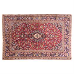 Central Persian Kashan hand-knotted rug, crimson field, profusely decorated with scrolling...