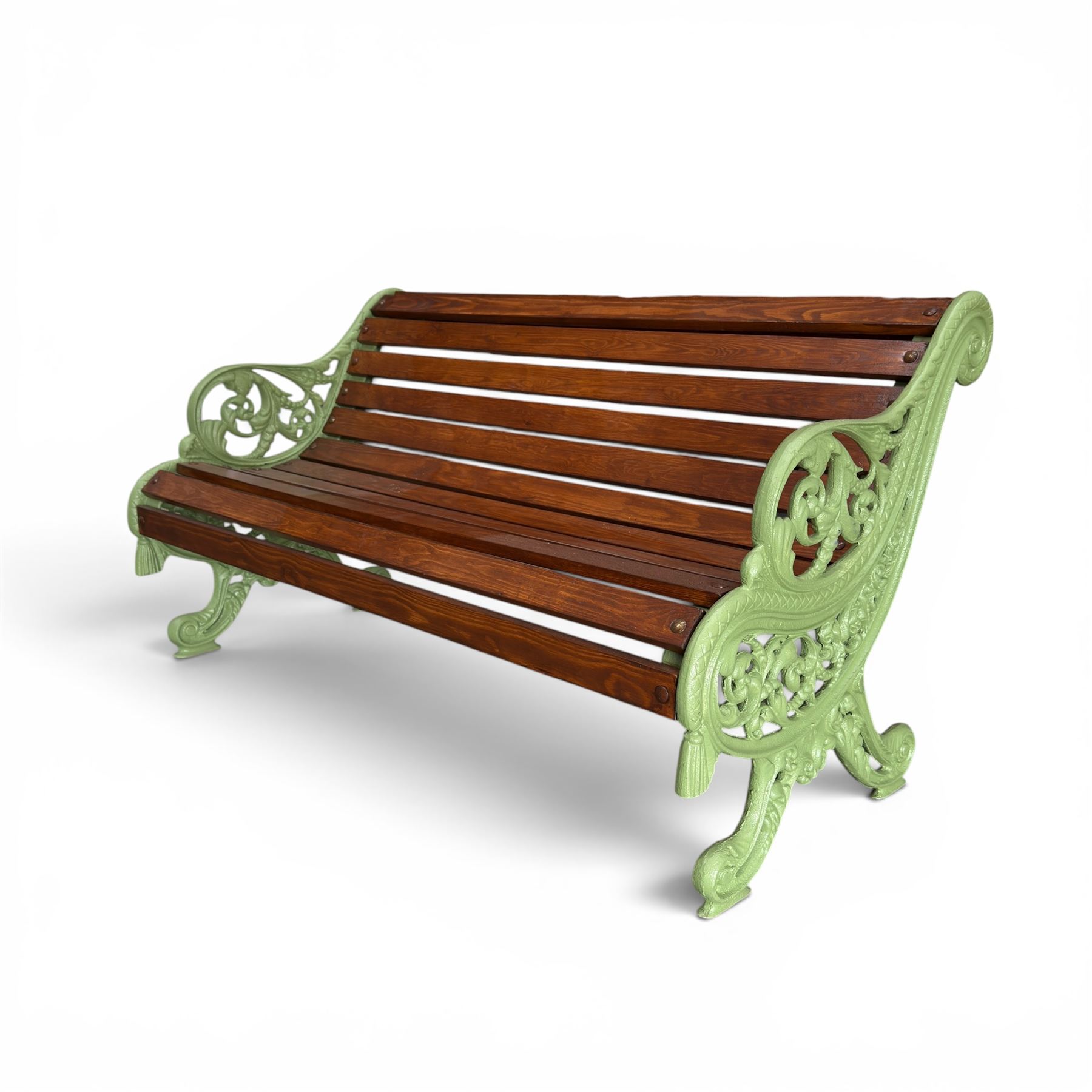 Pair of Victorian design cast iron and slatted wooden garden benches, the ornate pierced end supports of scrolled form, the pierced acanthus leaves interspersed with trailing flowerheads, with tassels to the front, raised on splayed feet, the supports in pale sage green painted finish