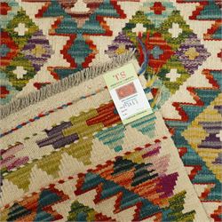 Chobi kilim runner, flatwoven with repeating hooked diamond motifs in shades of red, green, blue, yellow and cream, framed by geometric guard borders