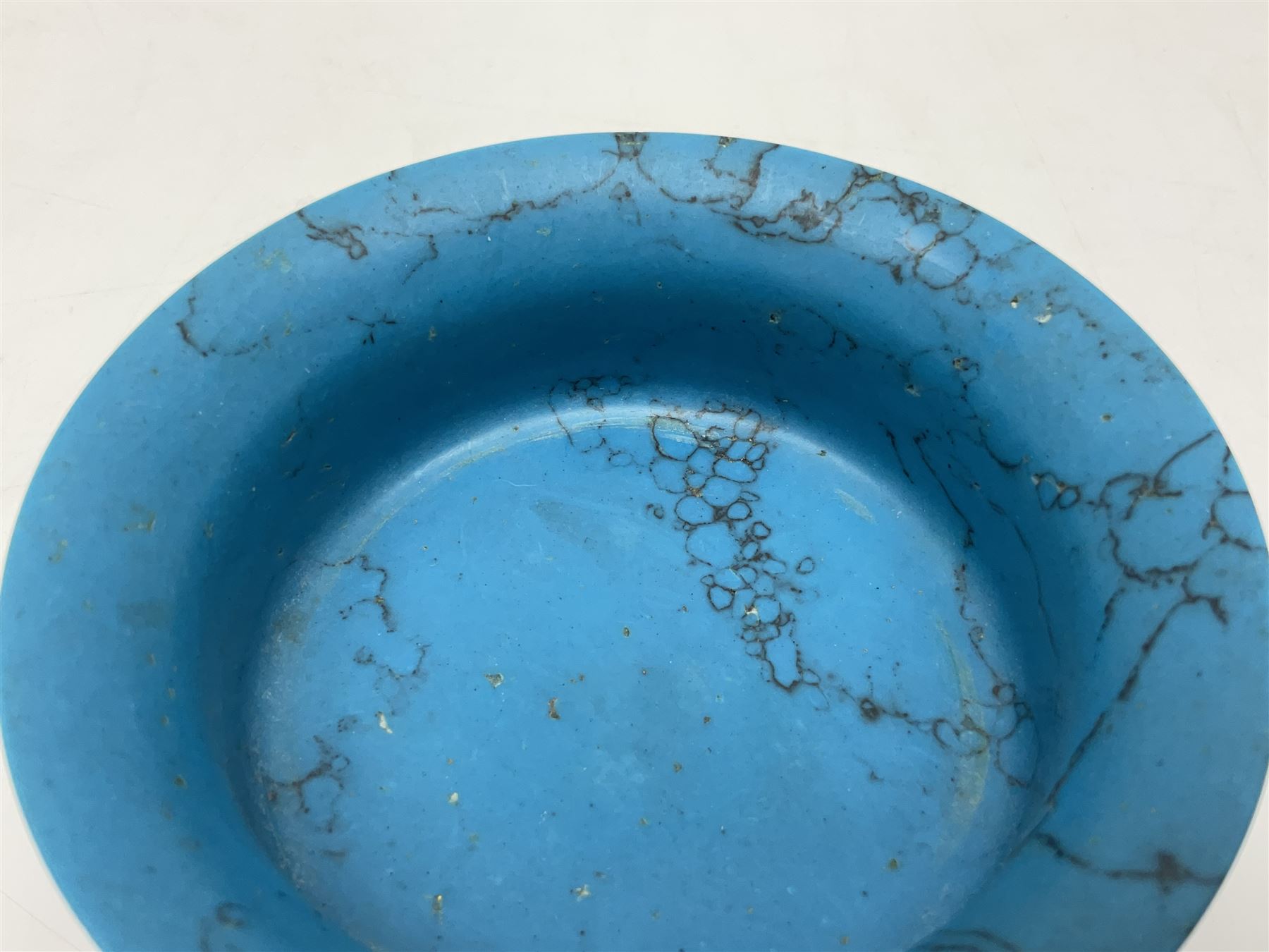 Carved single piece turquoise bowl with fluted rim, upon a raised footed base, D10cm, H5cm