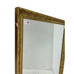 Victorian design gilt framed mirror, frame with scrolling foliate decoration (101cm x 69cm); with another similar with bevelled plate (75cm x 64cm)