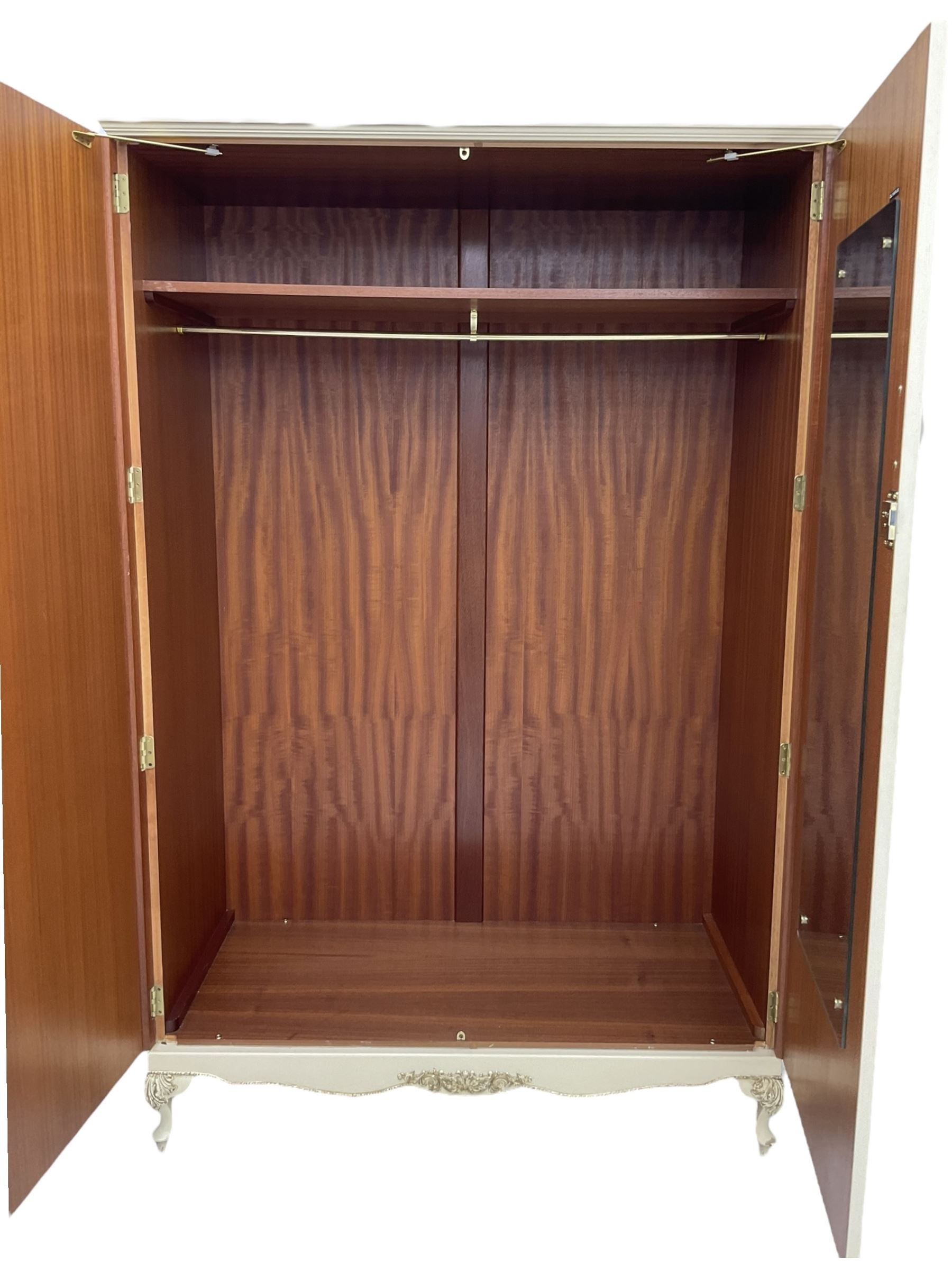 French classic design cream painted double wardrobe, the doors decorated with gilt and cream applied urn motifs with extending bell-flower festoons and ribbon twists, enclosing shelf and hanging rail, shaped apron on acanthus cabriole feet