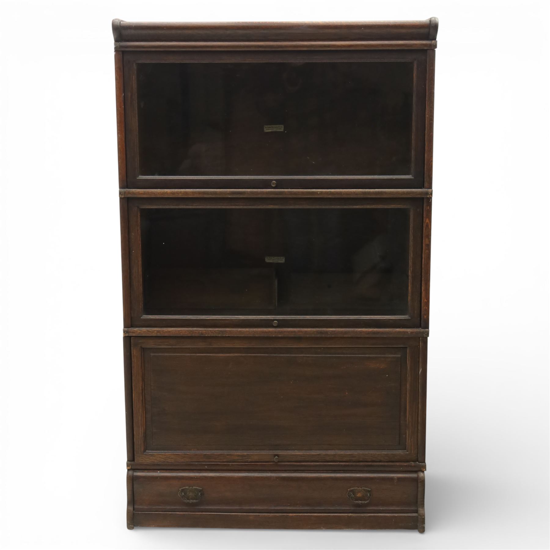 Globe Wernicke - early 20th century three sectional stacking library bookcase, two glazed sections above a panelled section, on a plinth base with inbuilt drawer