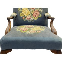 Georgian mahogany Gainsborough armchair, curved and scroll carved arm terminals and supports, the back and sprung seat upholstered in floral tapestry, cabriole supports