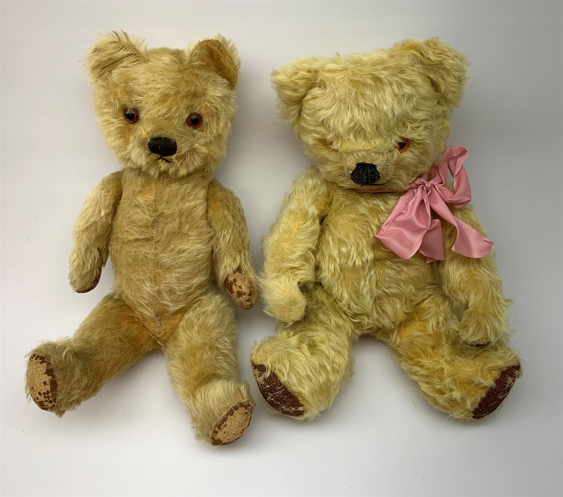 Five English teddy bears c1930s-50s comprising Chad Valley with swivel jointed head, glass eyes, vertically stitched nose and mouth and jointed limbs with rexine pads H16
