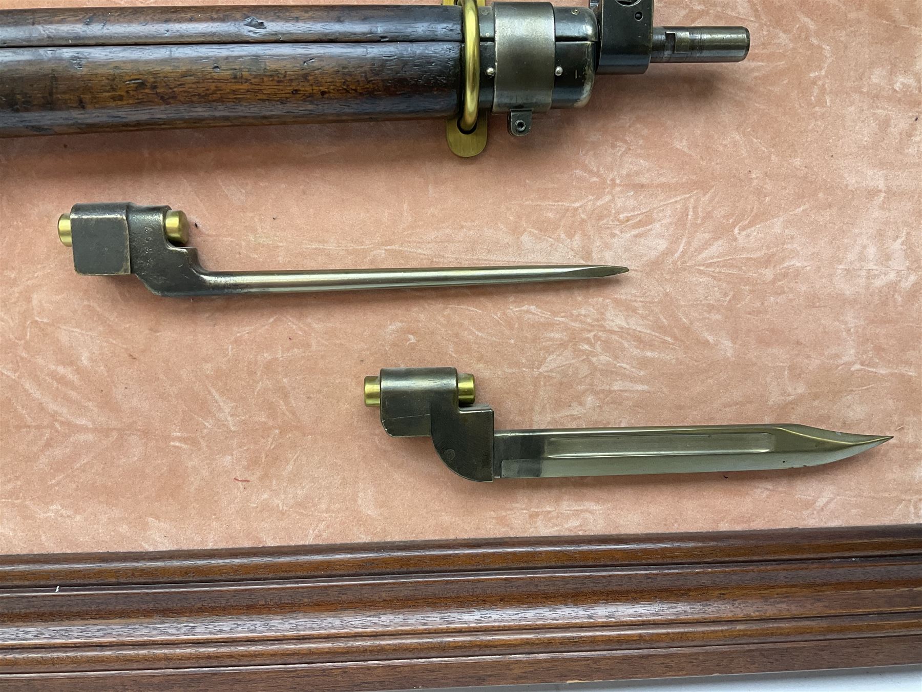 WW2 Lee Enfield No.4 Mk.1 .303 bolt-action rifle with hinged butt compartment, made by SA Ltd., Long Branch, Canada 1942, serial no.5L0646 L113cm; mounted on a framed display board with No.4 Mk.II spike bayonet, No.9 Mk.1 blade bayonet, two inert 5-round clips and brass biographical plaque by Antler Military Originals detailing DA Cert No.C3444 OLD STYLE DEACTIVATION SO FIREARMS CERTIFICATE REQUIRED OR RFD