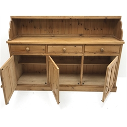 Traditional waxed pine dresser, top section fitted with two glazed display cabinets, shelf and spice drawers, lower section with three drawers and three panelled cupboards, on plinth base, W190cm, H200cm, D47cm  