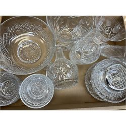 A collection of glass ware, including cranberry glass with a dear etching, collection of  cranberry glass jugs, one with a clear glass stopper, a baluster form decanter with a tear drop stopper, seven glass bowls etc, four boxes. 