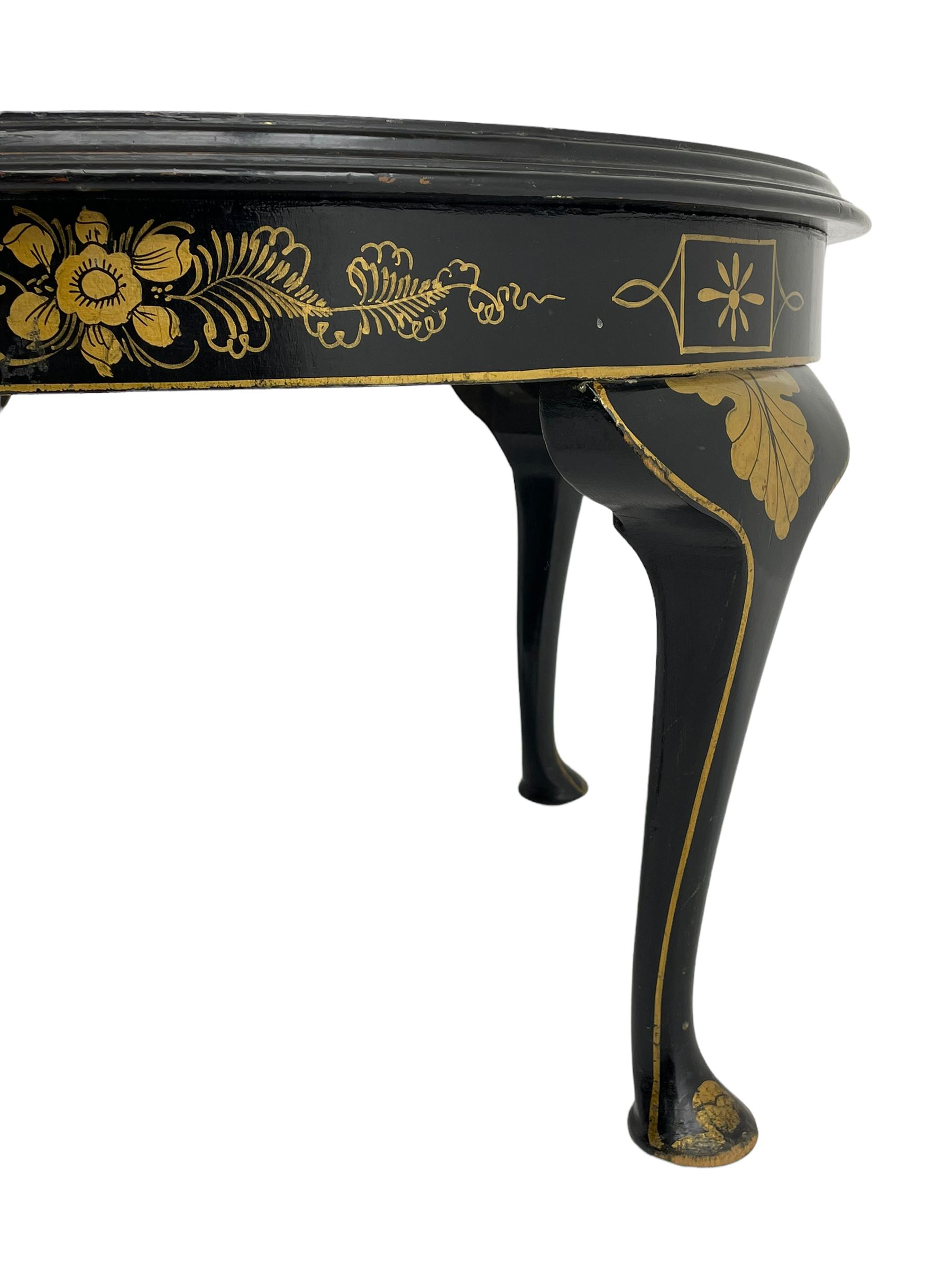 Early 20th century Chinoiserie lacquered circular occasional table, raised gilt decoration depicting traditional landscape scenes, on cabriole supports
