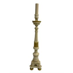 Classical design ivory and gilt painted lamp or candle stand, the reeded and turned column terminating in triform base with compressed bun feet