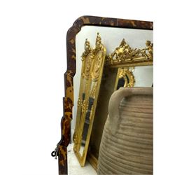 Early 20th century wall hanging tortoise shell framed mirror, of rectangular form, the upper half of the frame shaped and stepped surrounding a plain mirror plate