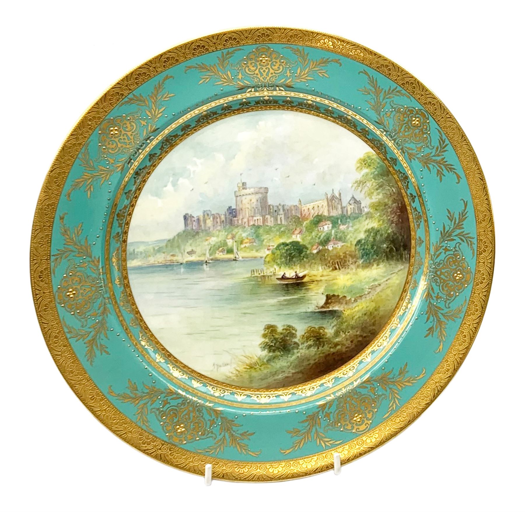 Large Minton cabinet plate, with central hand painted panel of Windsor Castle, signed A Holland, within a tooled gilt turquoise border, with impressed and printed marks and inscribed Windsor Castle beneath, D32cm