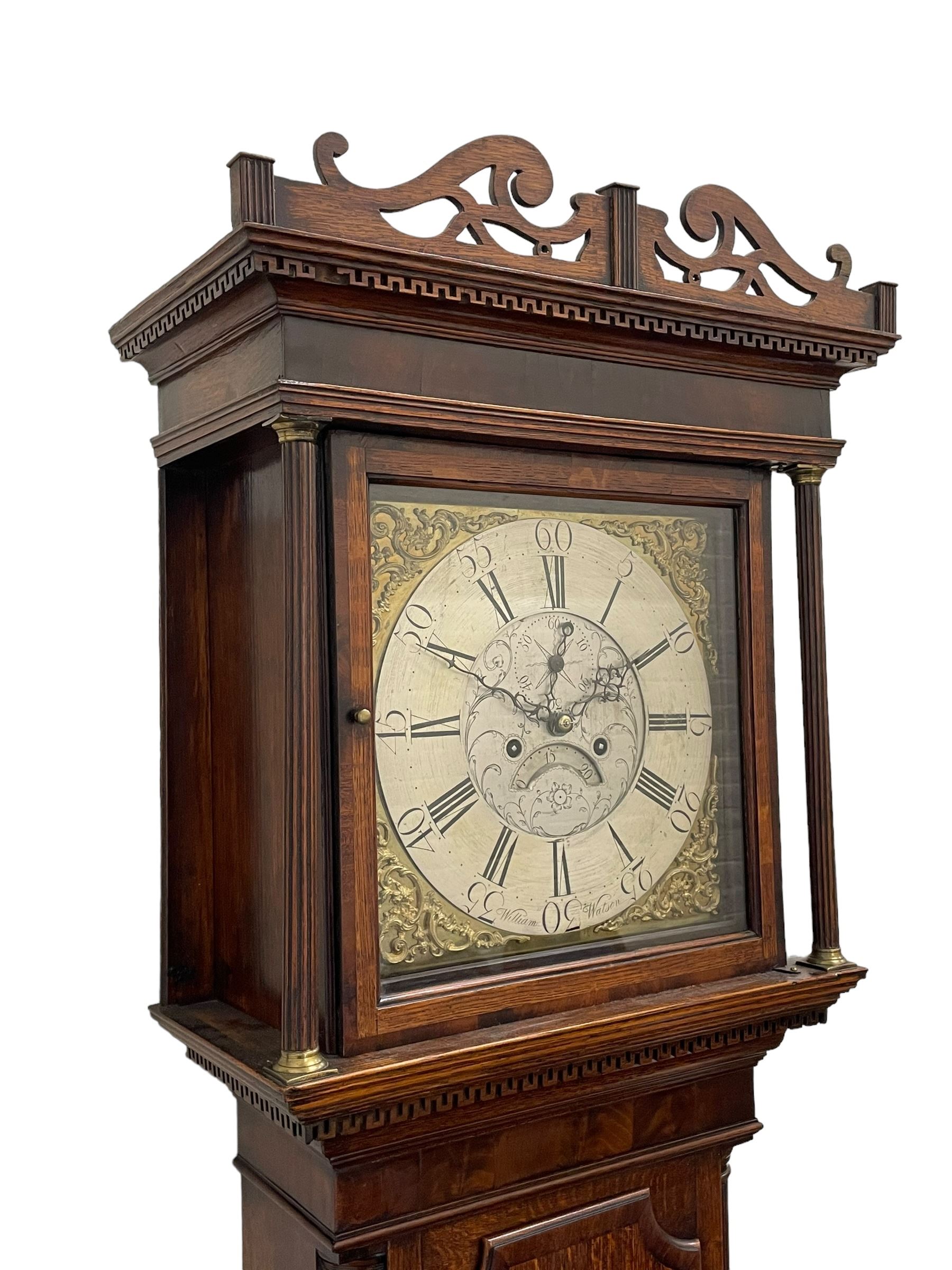 William Watson of  Blackburn (Lancs)  - late 18th century 8-day oak and mahogany cross banded longcase clock, with a flat top and open fretwork above, deep cornice with dogtooth moulding and frieze beneath, square hood door flanked by reeded pilasters with brass capitals, trunk with  reeded quarter columns, long trunk door with concave corners on a plinth with canted corners on bracket feet, brass dial with cast brass spandrels, broad silvered chapter ring with Roman numerals and five-minute Arabic's, a profusely engraved and silvered dial centre with seconds dial, matching steel hands and calendar aperture, hourly rack striking movement with a recoil anchor escapement. With weights, pendulum and key. 
William Watson of Northgate, Blackburn, is recorded as working c1770-1814 . As with this clock Watson frequently signed some of his clocks without a placename.