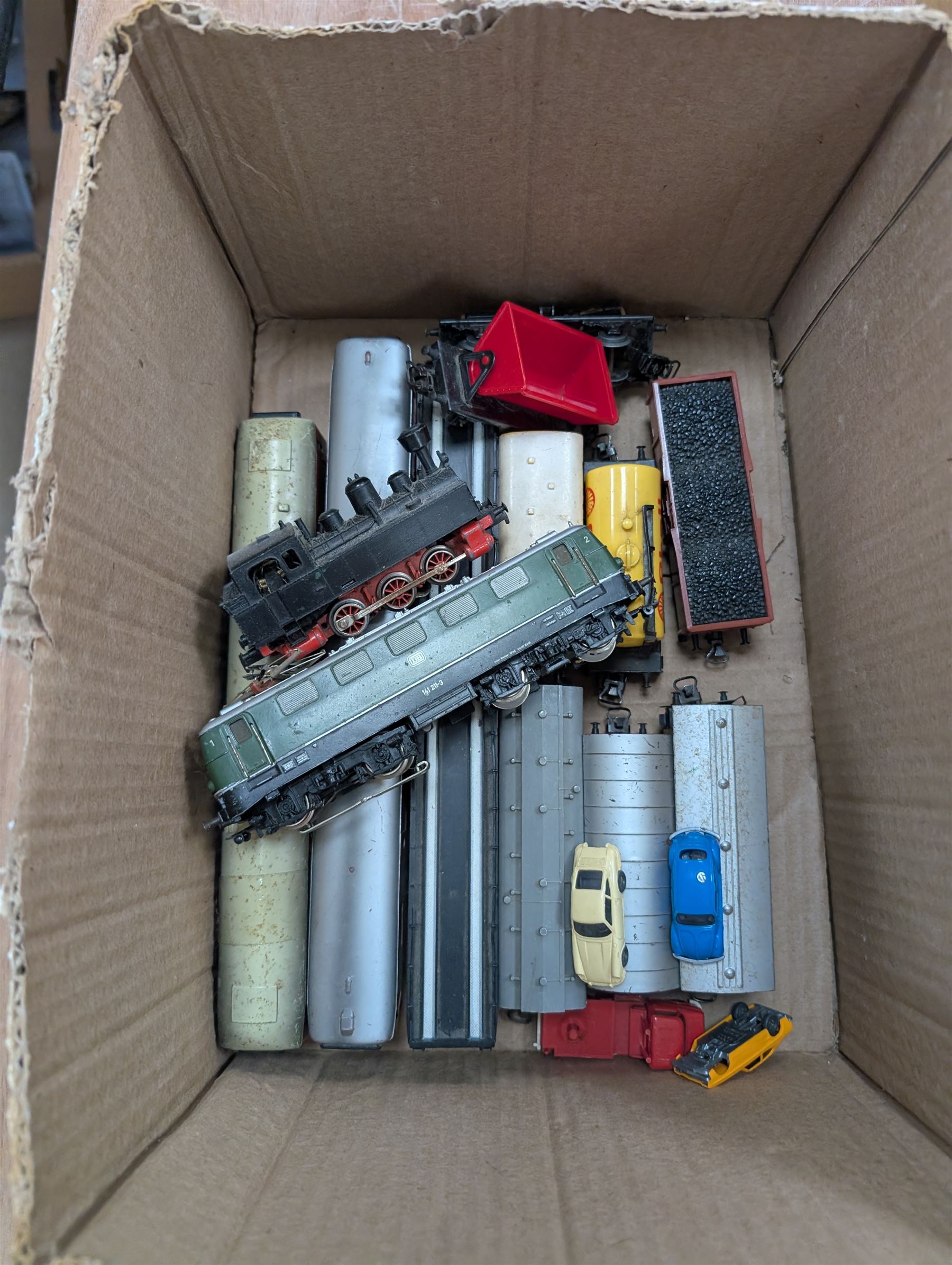 Marklin HO gauge model railway, comprising two Marklin H0 gauge locomotives, including electric DB class example and a steam locomotive, controller, tin plate track and rolling stock