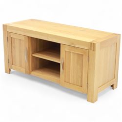 Contemporary solid oak television stand, rectangular top over an open central section with adjustable shelf, flanked by cupboard doors with vertical recessed panel fronts and brushed steel handles, on block feet