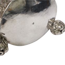 Northern European silver peg tankard, probably late 18th/early 19th century, of cylindrical form, the body repoussé decorated with scrolling and blossoming acanthus, fitted with scroll handle with shield terminal, the hinged cover with conforming repoussé decoration surrounding a central circular panel engraved with monogram beneath initials EASBGD, opening with ball thumbpiece detailed with fruits, raised upon three confirming ball feet mounted with shaped panels also detailed with fruits, bearing indistinct mark beneath, H19cm