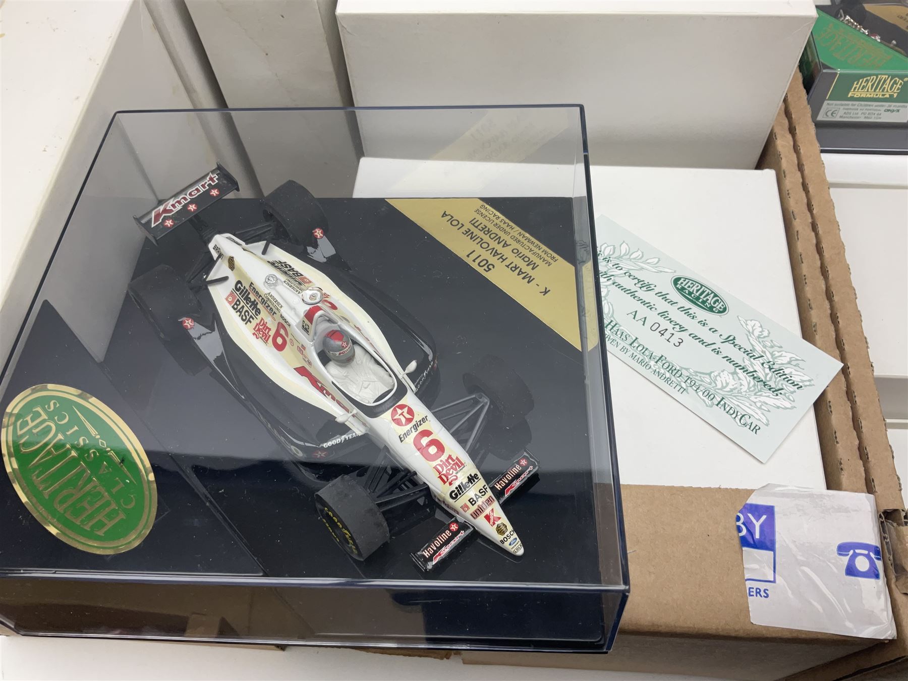 Heritage - thirty-five die-cast model racing cars comprising twenty-five Heritage Formula 1 1:43 scale models including Ferrari, Lotus, Yamaha etc; and ten Special Edition models including Williams Renault Ayrton Senna, David Coulthard and IndyCar, etc with certificates; and a Heritage Classics Damon Hill helmet; all in display boxes, many with original packaging (36)