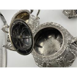 Victorian silver three piece tea service, comprising teapot, twin handled open sucrier, and milk jug, each of bellied form with acanthus capped scroll handles, the sides embossed with alternating scroll edged vacant panels and panels containing a pair of birds, upon four palmette feet, the teapot with ivory insulators to handle, and bird finial to the hinged domed cover, hallmarked William Hunter & Son, London 1861, teapot H19cm, including handles sucrier H13.5cm, including handle milk jug H12cm

This item has been registered for sale under Section 10 of the APHA Ivory Act