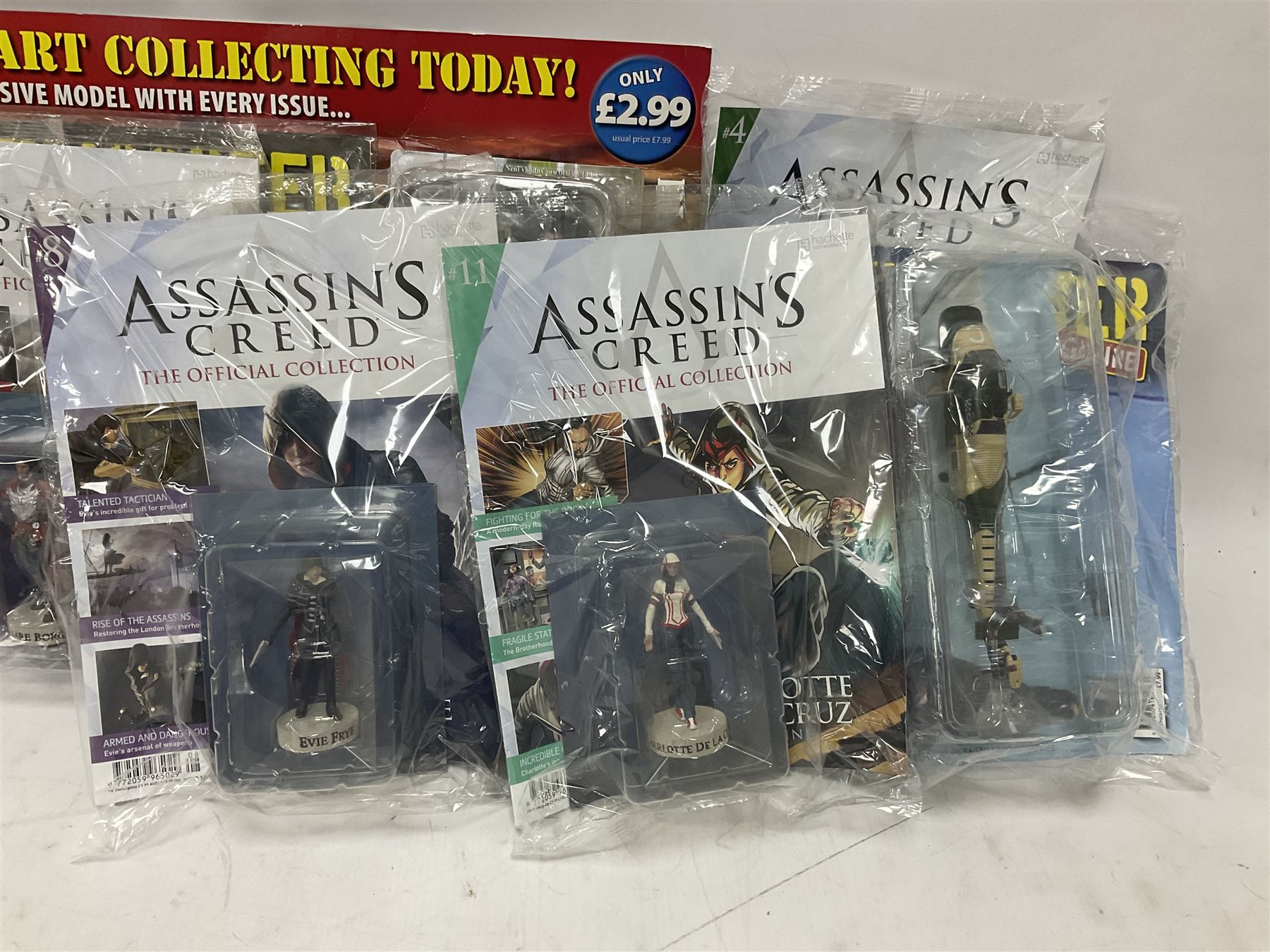 Fifteen Amer Czechoslovakia periodical issued metal models of helicopters each in unopened original packaging with copy of 'Helicopter Magazine'; together with seven unopened Hachette 'Assassin's Creed' periodical figures with magazines (22)