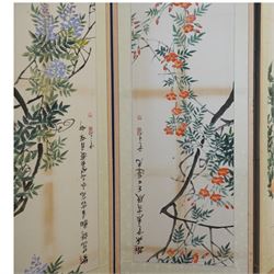 Large 20th century eight panel folding screen decorated with Chinese watercolours of blossoming trees, the watercolours backed onto foliate patterned silk panels, each inscribed and signed with artists seal, with navy fabric to the opposing side, each panel measuring 47cm x 163cm