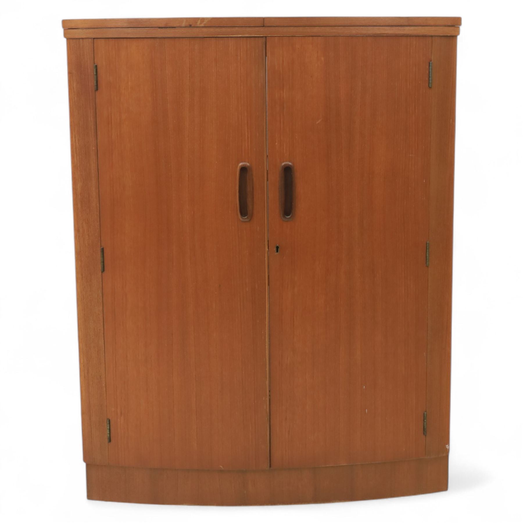 Turnbridge of London - Mid 20th century teak cocktail cabinet, with fold out top extending to 160cm, with twin doors revealing a shelved interior, the back with sliding glazed doors, raised on a recessed plinth base with castors