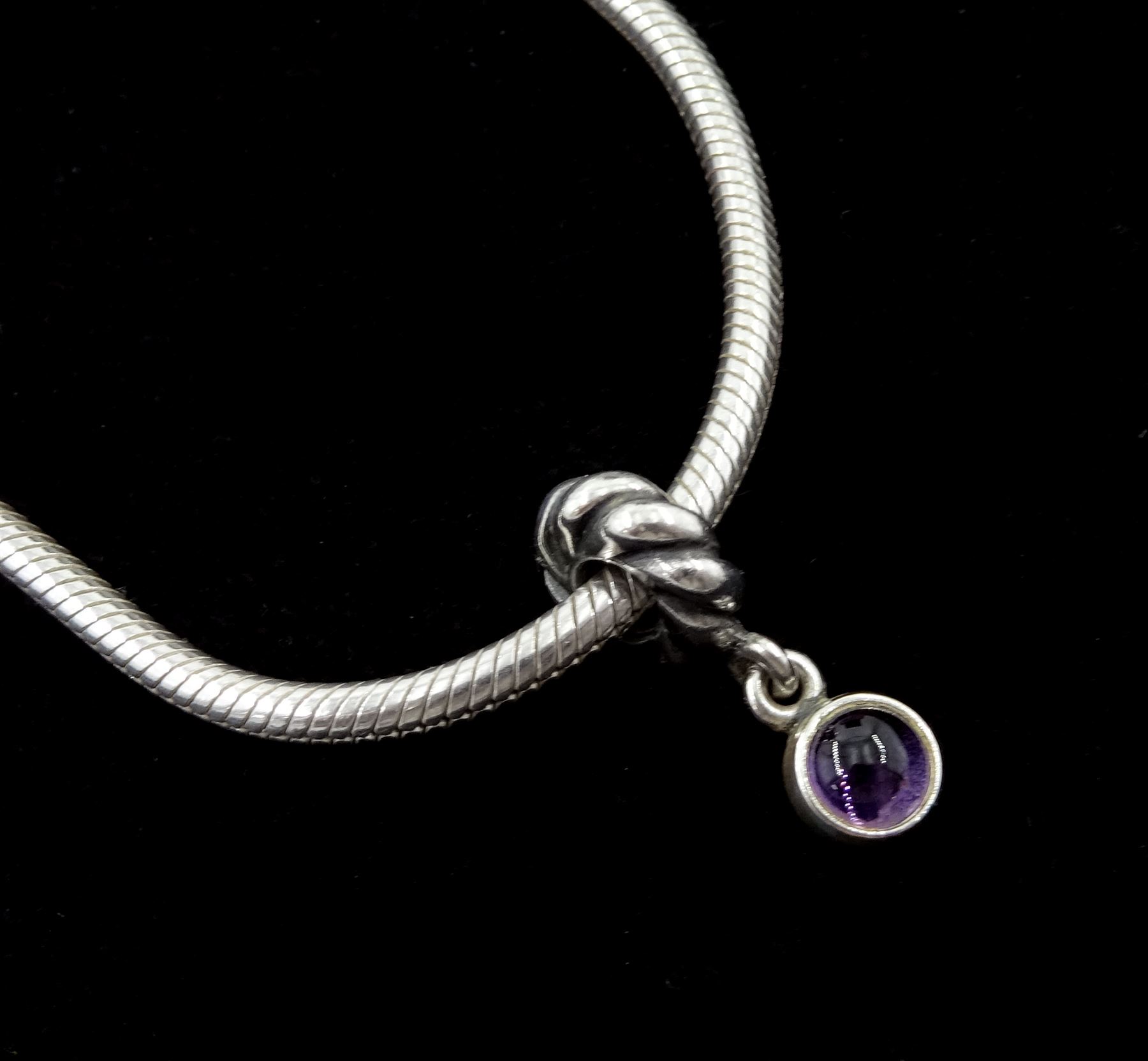 Collection of silver Pandora jewellery comprising a bracelet with thirteen Pandora charms and safety chain, necklace with one Pandora charm, and one stone set ring, in Pandora box