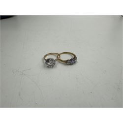 Two 9ct gold cubic zirconia rings, including single stone and three stone example, both hallmarked