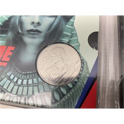 Six The Royal Mint United Kingdom commemorative five pound coins, four commemorating David Bowie and two commemorating The Who, all housed in card folders
