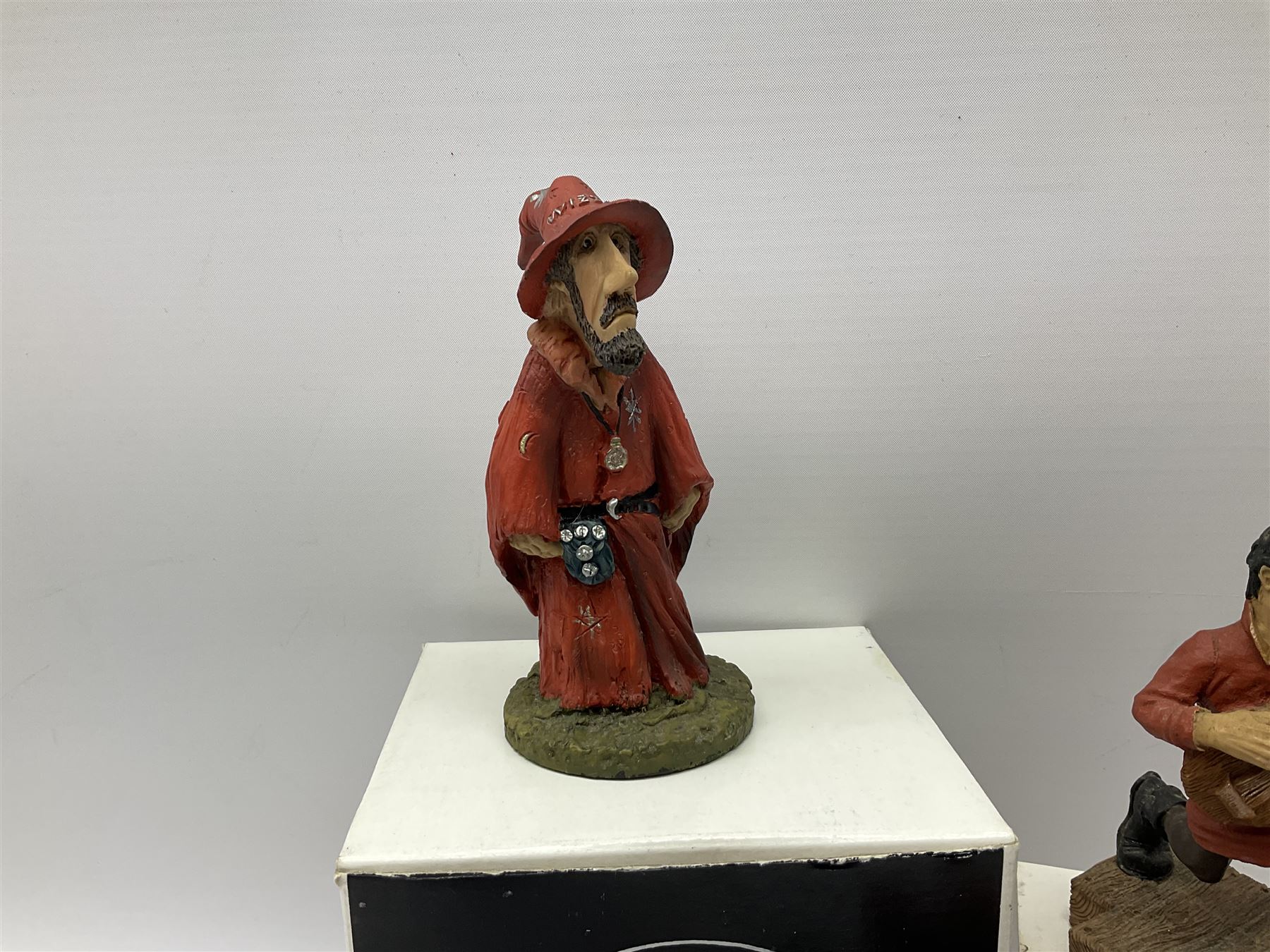 Terry Pratchett Discworld figures, designed by Clarecraft, comprising Rincewind and Luggage bookend DW41, Imp Y Celyn, DW81, C.M.O.T Dibbler, DW35, Rincewind, DW01 and Susan Sto Helit, boxed, DW77