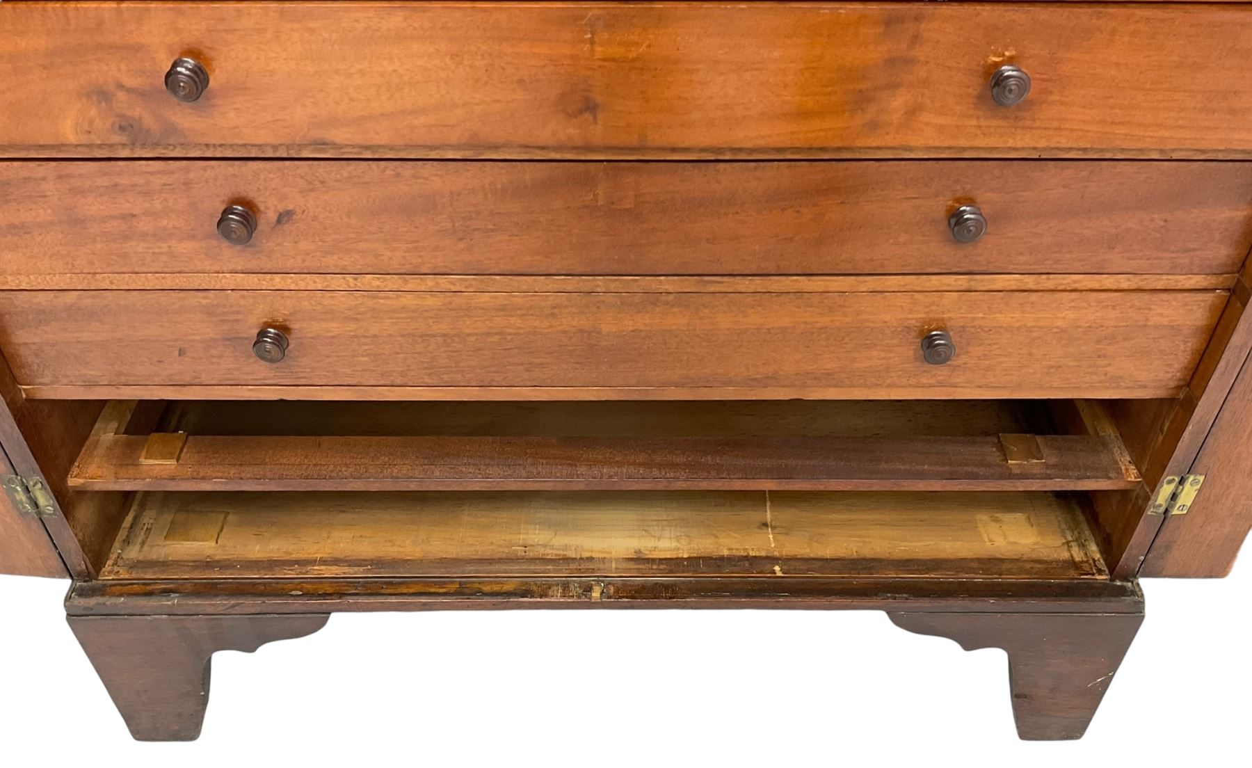 19th century mahogany collector's cabinet, crossbanded rectangular top over two panelled doors, the interior fitted with seven shallow drawers, on bracket feet