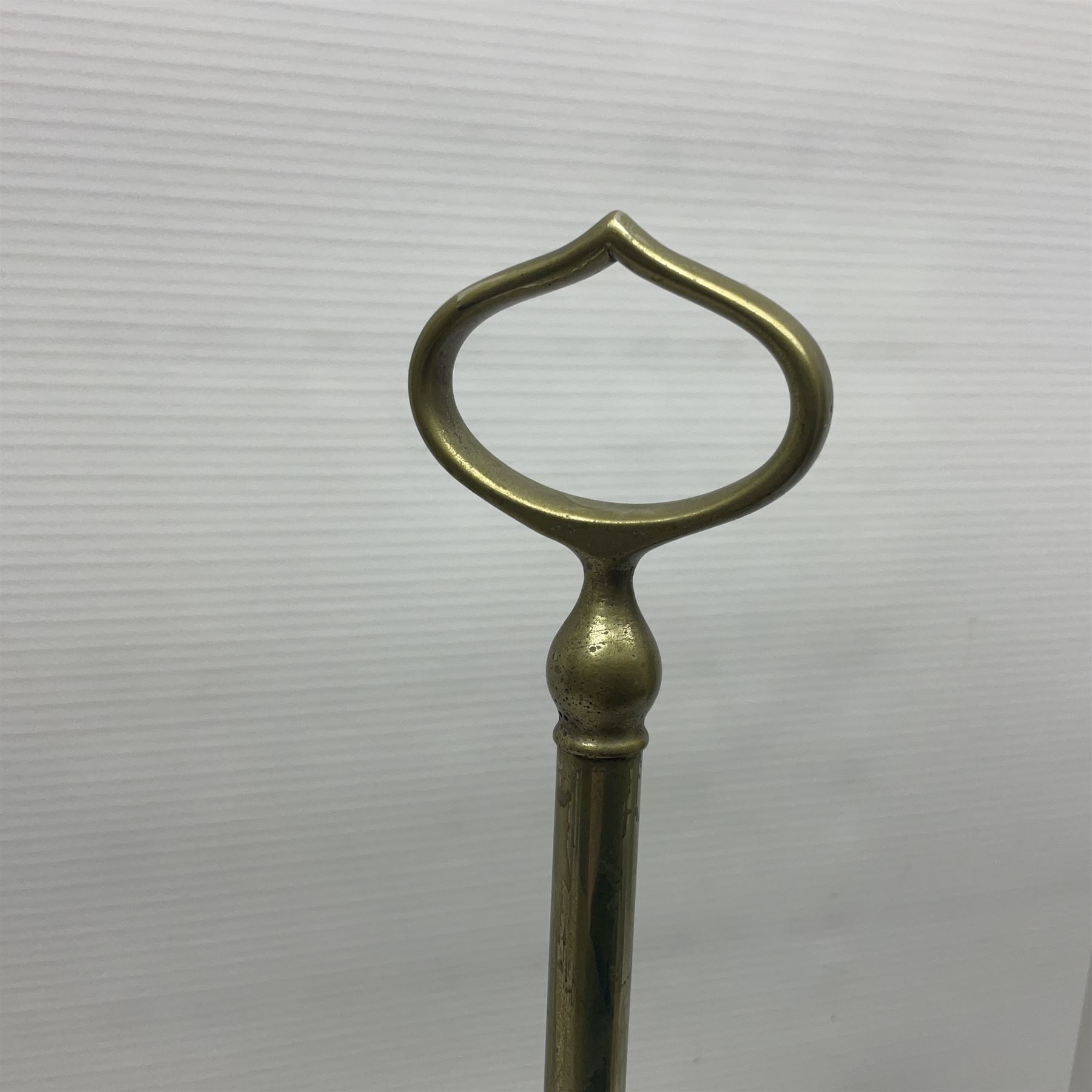 William H Honey polished brass adjustable student's oil lamp, with green glass shade, H60cm