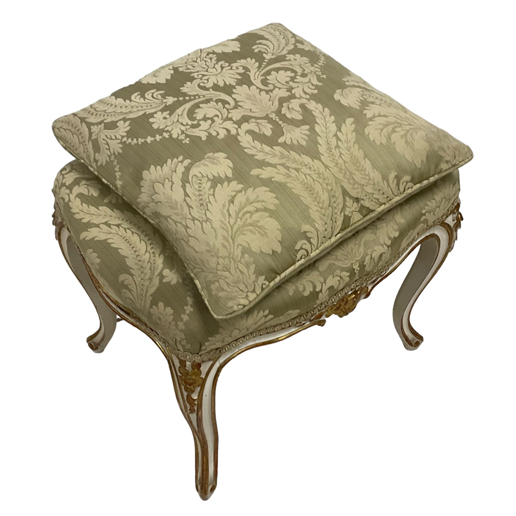 20th century French design parcel gilt and painted dressing table stool, upholstered in sage green damask fabric, shaped form on floral carved cabriole supports, with matching cushion 