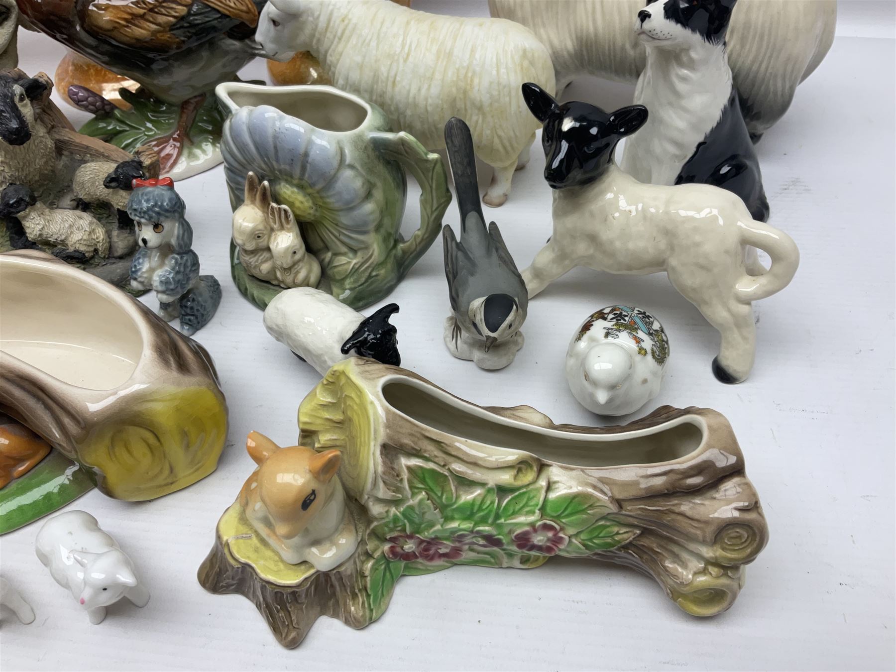 Two Hornsea Fauna vases, together with a similar jug, Coopercraft sheep and other collectables  