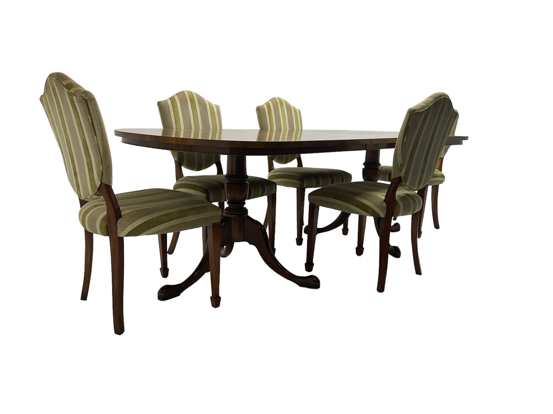 Regency design walnut twin pedestal extending dining table, rectangular burr top with rounded corners and crossbanding, raised on turned vasiform columns with tripod base, with additional leaf (D107cm W184cm/230cm, H76cm); and set eight (6+2) shield back dining chairs, upholstered in striped laurel green fabric, raised on tapering supports with spade feet, retailed by Geoffrey Benson