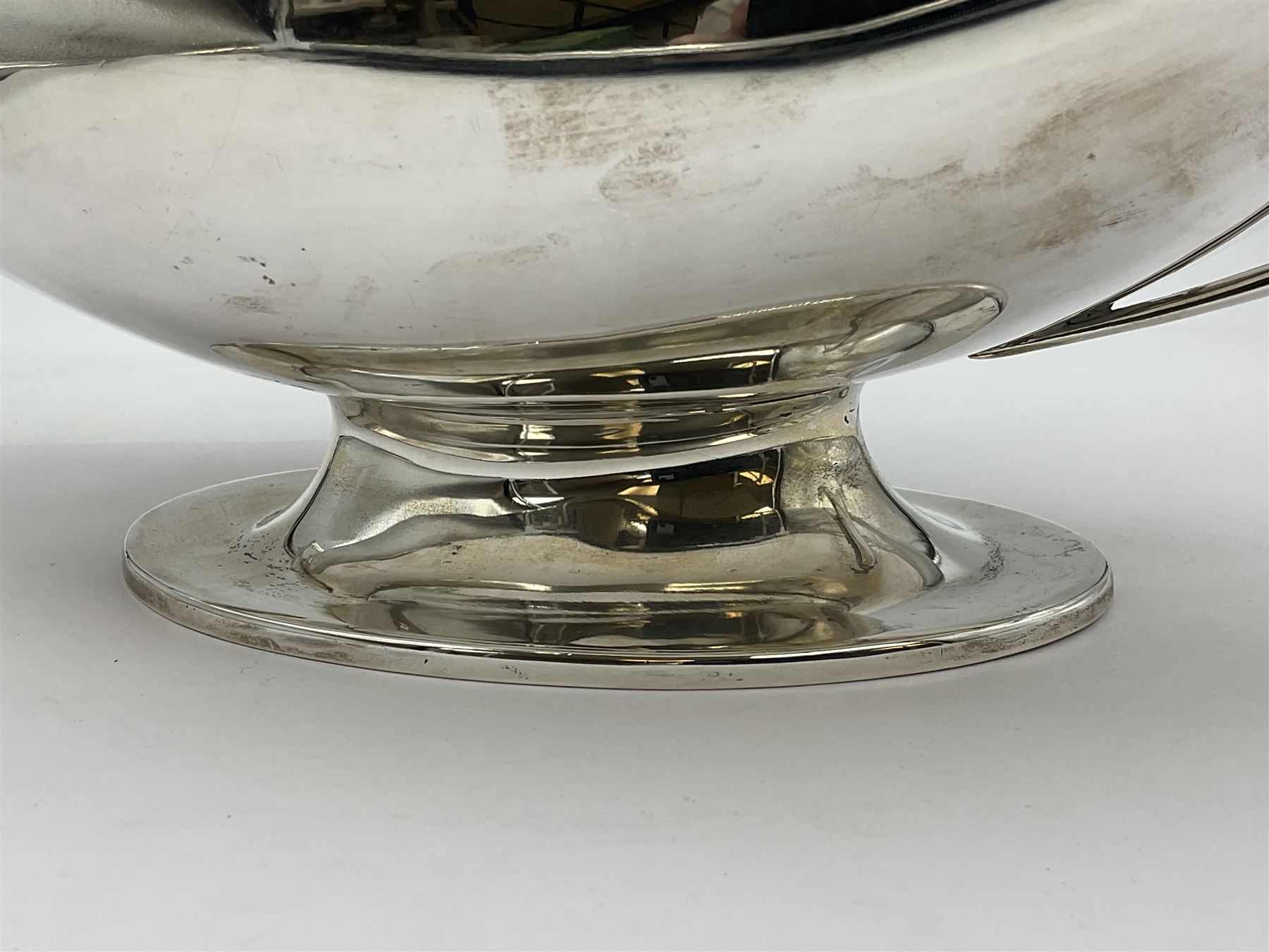 1920s silver twin-handled pedestal bowl, of navette form with twin bifurcated acanthus capped scroll handles, engraved with initial R to body and upon spreading oval foot, hallmarked Hawksworth, Eyre & Co Ltd, Sheffield 1925, including handles H21.8cm